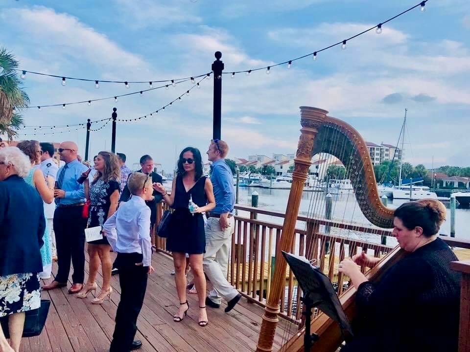 Wedding Place in Pensacola with guests at cocktail hour on waterfront