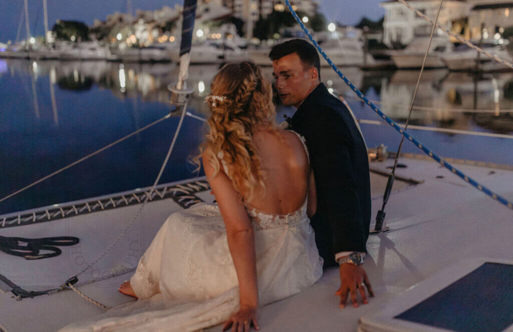 Wedding Places showing couple taking a private moment on boat